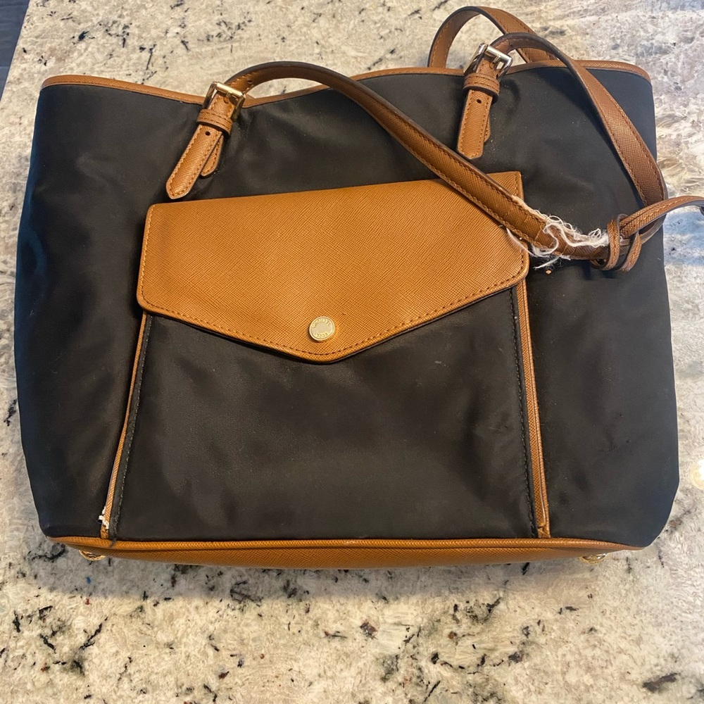 Michael Kors purses needs TLC. Handles ripped
